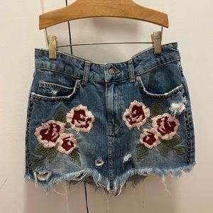 Free people jean skirt with embroidered roses and cute studs! No flaws